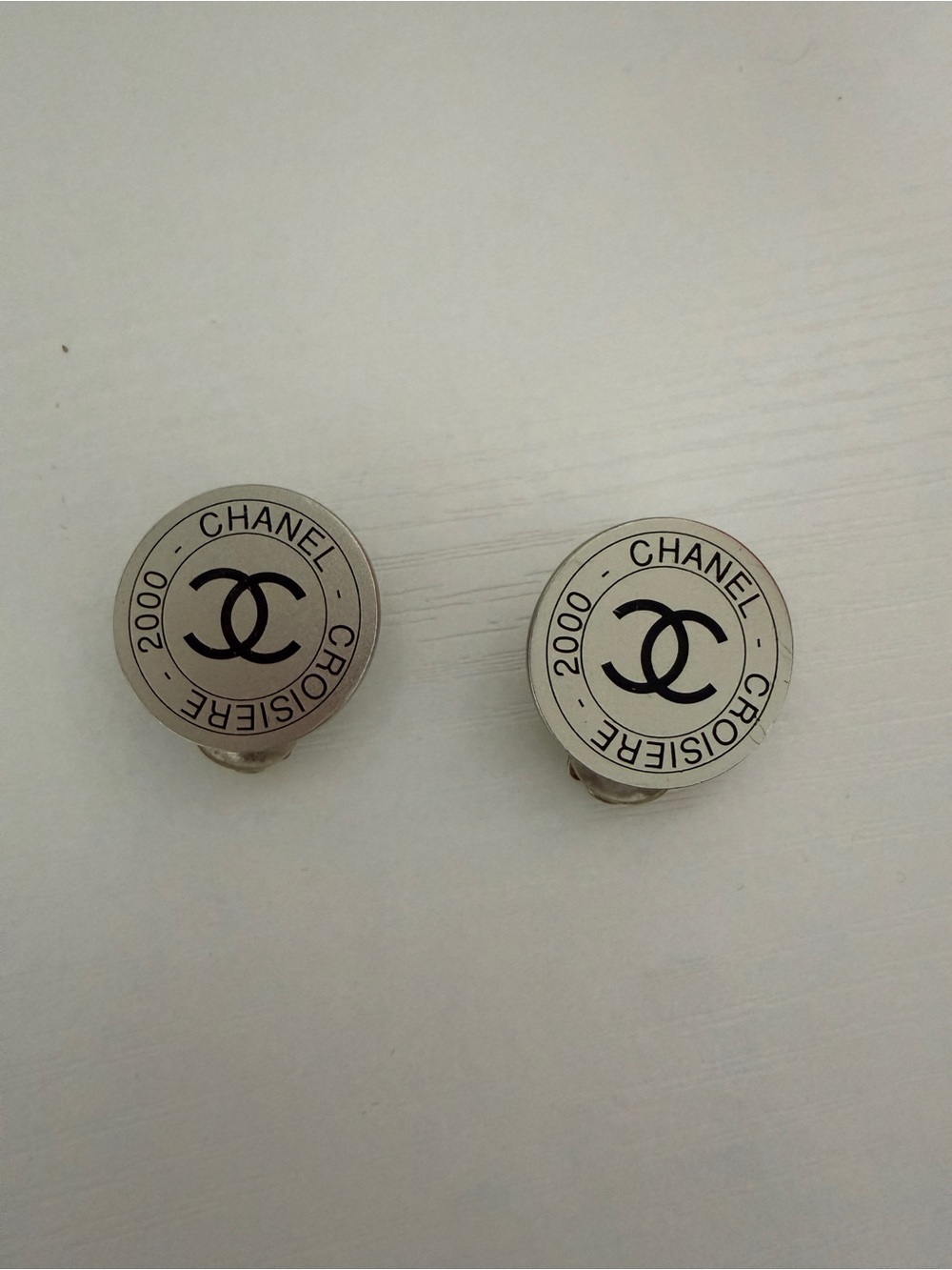 CHANEL Silver-Tone Round Logo Clip-On Earrings with Black Enamel
